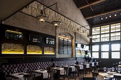 an empty restaurant with many tables and chairs