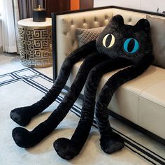 an octopus stuffed animal sitting on top of a couch