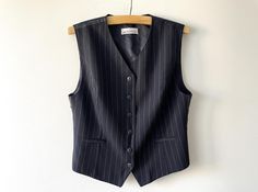 Vintage Black striped women's vest, formal wool blend waistcoat, Steampunk sleeveless blazer, office clothing, women businesslike outfit, gift for her, size large Label size: GB 16 Measurements: Length: 24.5" Pit to pit: 20" Please check measurements to insure a proper fit. Remember to allow yourself some extra room for movement. You can compare these with something from your closet that fits you well. Please convo me if you need additional measurements. Condition: Very Good vintage condition SH Outfit Large, Office Clothing, Sleeveless Blazer, Vest Outfits, Office Outfits, Women's Vest, Buy Vintage, Clothing Women, Label Sizes