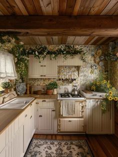 an old fashioned kitchen with sunflowers growing on the wall and wood flooring