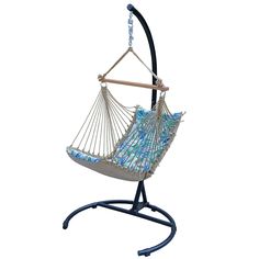 a blue and white hammock hanging from a stand