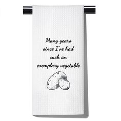 a white towel with black writing on it that says, many years since i've had such an embroidery vegetable