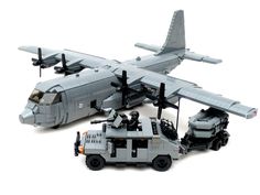 an airplane and truck are shown with legos on the ground next to it's cargo carrier