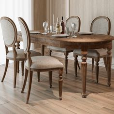 a dining room table with chairs around it