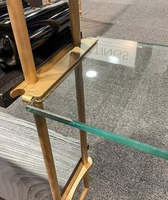 a glass and wood table on display in a store