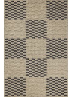 an area rug with black and white checkered squares on the side, in neutral colors