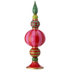 a red, green and gold lamp on a white background