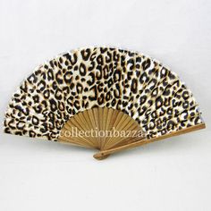 an animal print hand fan on a white background