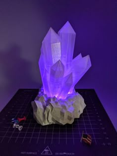 a purple light is on top of a rock