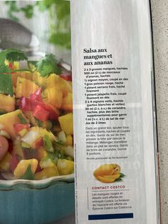 a cookbook with an image of a bowl of fruit and vegetables on the page