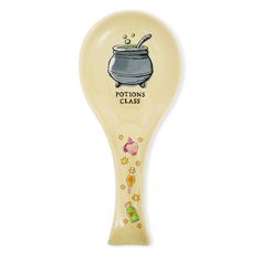 a spoon with an image of a pot on it's side and the words potters class