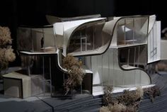 an architectural model of a house on display