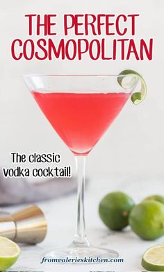 the perfect cosmopolian cocktail in a martini glass with limes around it