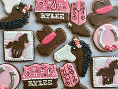 decorated cookies are arranged in the shape of horses and saddles