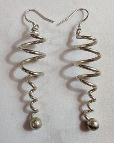 Here's an AWESOME pair of shiny sterling silver swirl & twisted shaped earrings! These are marked .925 as seen in the last picture. These would be super pretty for Valentine's Day! These are extremely nice and would go with many different chains! The condition of these are PERFECT , and are  BRAND NEW without their factory original packaging! I will be listing several vintage clip & pierced earrings in the following week; approximately 10+ pairs a day! Thanks for viewing my items! Please check photos for extra details and information! I will be listing lots of jewelry & items in the next few days & weeks! Jewelry items include: Vintage & New jewelry pieces, Clip Earrings, Pierced & Post Earrings, Bracelets, Necklaces, Pendants, Charms, Rings, Jewelry Sets, ect To look up my Jewelry items, Vintage Clip, New Jewelry, Rings Jewelry, Clip Earrings, Pierced Earrings, Earings Piercings, Post Earrings, Silver 925, Clip On Earrings