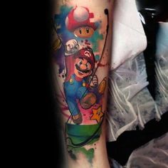 a person with a tattoo on their arm that has an image of mario in it