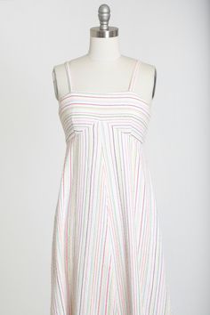 "Amazing Vintage 1970s chevron striped maxi dress Woven striped rainbow motif Empire waist Zips in back Excellent condition made very well M e a s u r e m e n t s: fits like a XS S Bust: 16 1/2\" Waist: 15\" Hips: 31\" Total Length: 53\" Straps: little over 1/2\" wide Sleeveless Label: n/a Fabric: cotton +All Measurements are taking while garment is lying flat+ + Jewelry, belts, and any other accessories are NOT included unless specifically stated in description + i n s t a g r a m: cali_vintage Retro Striped Lined Dress, Striped Lined Sundress, Striped A-line Lined Dress, Retro Striped Midi Dress, Spring Striped A-line Maxi Dress, Striped Sundress With Lining, Striped Fitted A-line Maxi Dress, Retro Striped Spring Dresses, Retro Striped Dresses For Spring