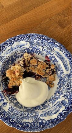 a blue and white plate topped with dessert