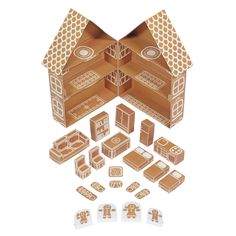 an open cardboard box with cut outs and stickers on the inside, including gingerbread houses