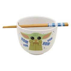 a bowl with chopsticks in it and the words mom yoda on it