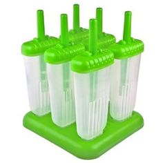 four plastic cups with green handles and straws in them on a stand against a white background