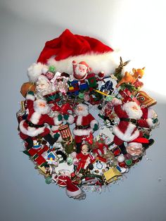 a bunch of santa claus's and other christmas decorations