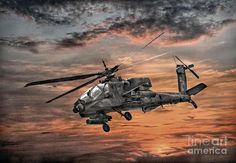 the helicopter is flying high in the sky at sunset or dawn with its landing gear down