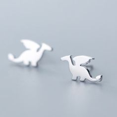 Sterling Silver Dinosaur Earrings 925 Sterling Silver Width Of Dinosaur Earrings Are Approximately 7/16" Comes With Clear Rubber Backings. Other Styles Available. Want To Mix And Match? Let Me Know And I'll See What I Can Do. :) Polish Clothing, Tiny Dragon, Dragon Silhouette, Dinosaur Earrings, Cute Dragon, Stud Style, Silver Dragon, Tiny Earrings, Cute Dragons