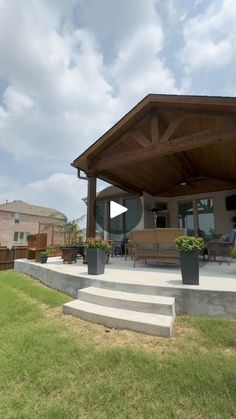 a covered patio with steps leading up to it