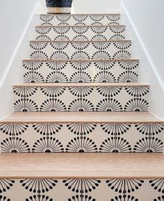 the stairs are decorated with black and white designs, which give it a unique effect