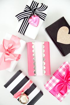 several different types of gift boxes with bows on them