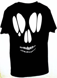 Show off your awesome style with a Skull Cutout T Shirt!  Each Sassy's Edgy Designs shirt is hand-cut all the way through the fabric so you have the option to wear something underneath or let your skin show through. *All designs are on the back of each t shirt! **Please review the sizing chart before purchasing your skull cutout t shirt to make sure the shirt will fit because I do not accept refunds, thanks! Sizing is measured across the chest not the waist: Small: 34"-36" Medium: 38"-40" Large: 42"-44" X-Large: 46"-48" XX-Large: 50"-52" XXX-Large: 54"-56" Length from shoulder to bottom hem: Small: 27" Medium: 29" Large: 31" X-Large: 31.5" XX-Large: 32" XXX-Large: 34" Sassy's Edgy Design t shirts are made with a thin cotton t shirt and have raw edges. Because of this I HIGHLY recommend was Skull Cutout, Rocker Aesthetic, Aesthetic Rock, Different Necklines, Festival Shirt, Clothes Making, Rock Festival, Edgy Design, Rock Festivals