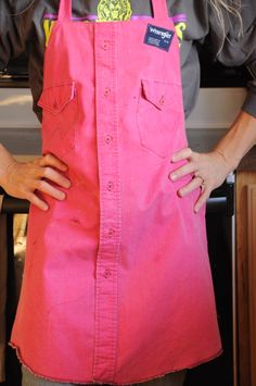 a woman is wearing an apron and has her hands on her hips