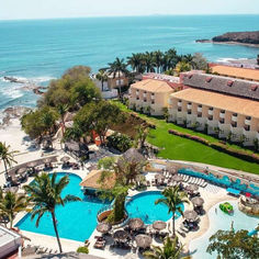 an aerial view of the resort and pool area