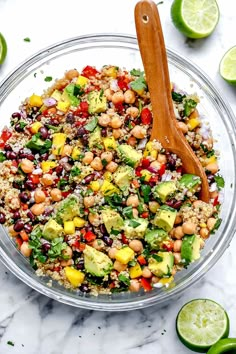 a bowl filled with rice, beans, avocado and cilantros