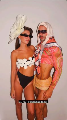 two people in swimsuits standing next to each other