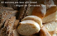 breads and loaves in a basket with the words, all sorows are less with bread miguel de cervantes don quixote