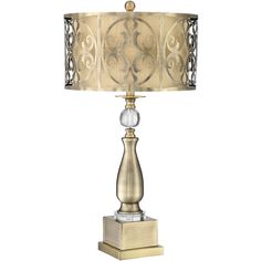 a table lamp with a gold shade on it