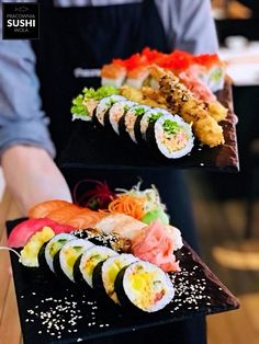 sushi platter with different types of sushi on it and in the middle