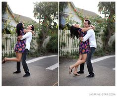 a man and woman are dancing in the street with their arms around each other as they hug