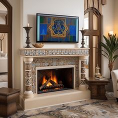 a living room with a fire place in the center and a painting on the wall