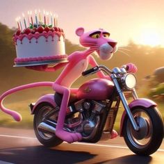 a pink cat riding on the back of a motorcycle with a birthday cake in it