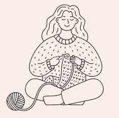 a woman sitting on the floor knitting with a ball of yarn in her hands and wearing a knitted sweater