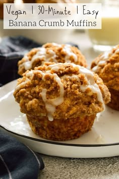 three muffins with icing on a white plate