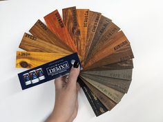 a person is holding a color wheel with different colors on it and the label in front of them