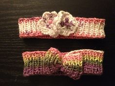 two crocheted headbands with flowers on them