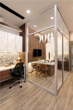 an office with glass walls and wooden floors