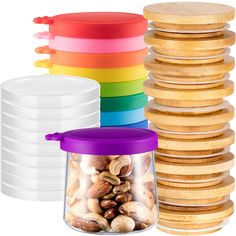 stack of plastic containers with wooden lids and nuts in front of stacks of stacked plates