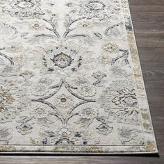 a white rug with an ornate design on it