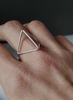 Geometry and architecture inspired this modern oxidized sterling silver ring. Edgy and minimalist, this ring is a great piece of jewelry that will enrich your look with style and originality. Extremely comfortable, it would also be a fab gift for someone really special! Please refer to the Official International Ring Size Conversion Chart, to determine your measure: http://www.ringsizes.co/ CARING FOR STERLING SILVER Sterling silver jewellery, if not worn for long periods of time, may develop a Modern Metal Ring With Oxidized Finish, Modern Geometric Sterling Silver Rings, Modern Sterling Silver Rings With Geometric Shape, Modern Sterling Silver Rings With Geometric Design, Modern Metal Rings With Oxidized Finish, Minimalist Sterling Silver Ring With Oxidized Finish, Modern Stackable Rings As A Gift, Modern Stackable Rings As Gift, Minimalist Metal Stackable Rings